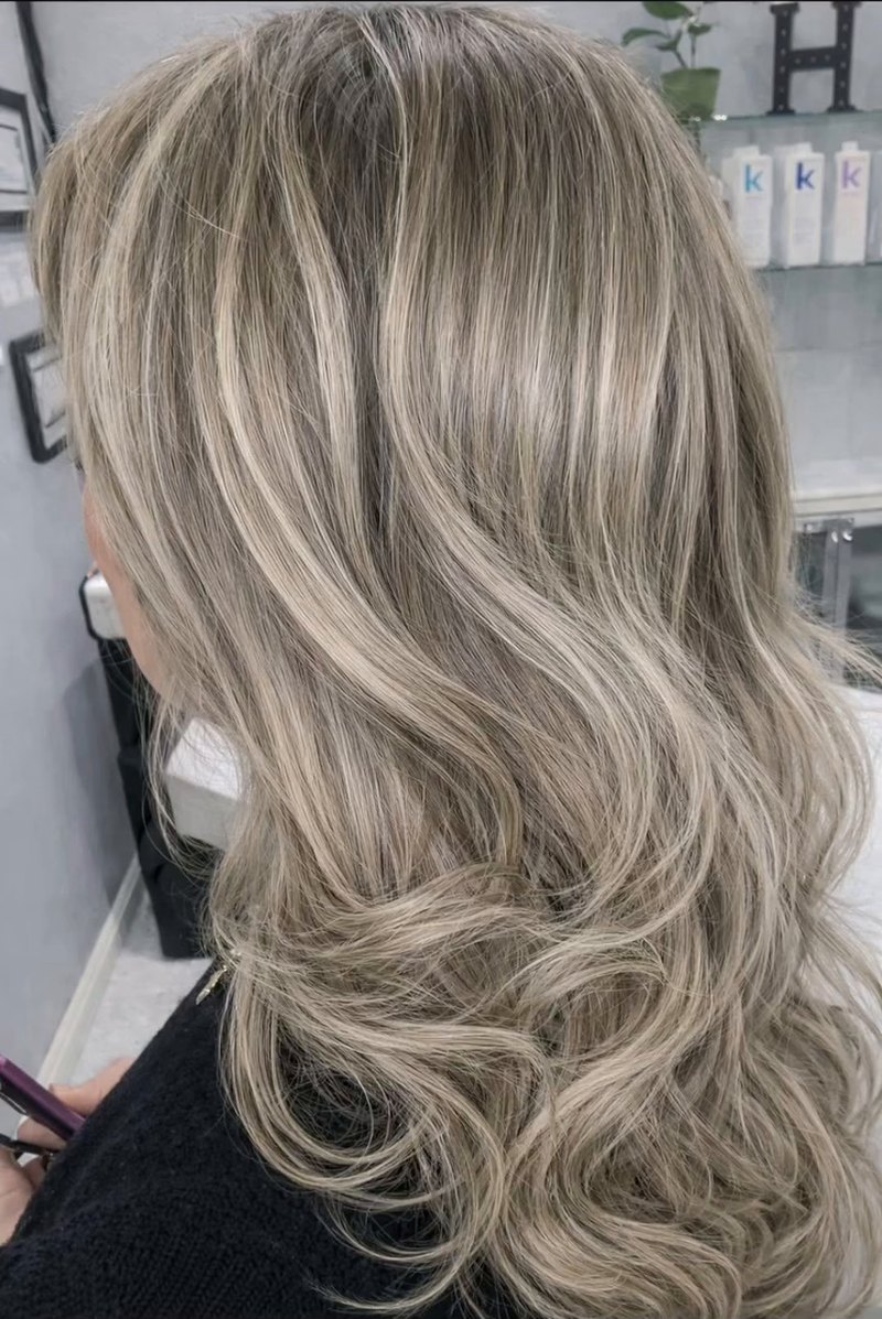 Soft ash blonde highlights with long waves